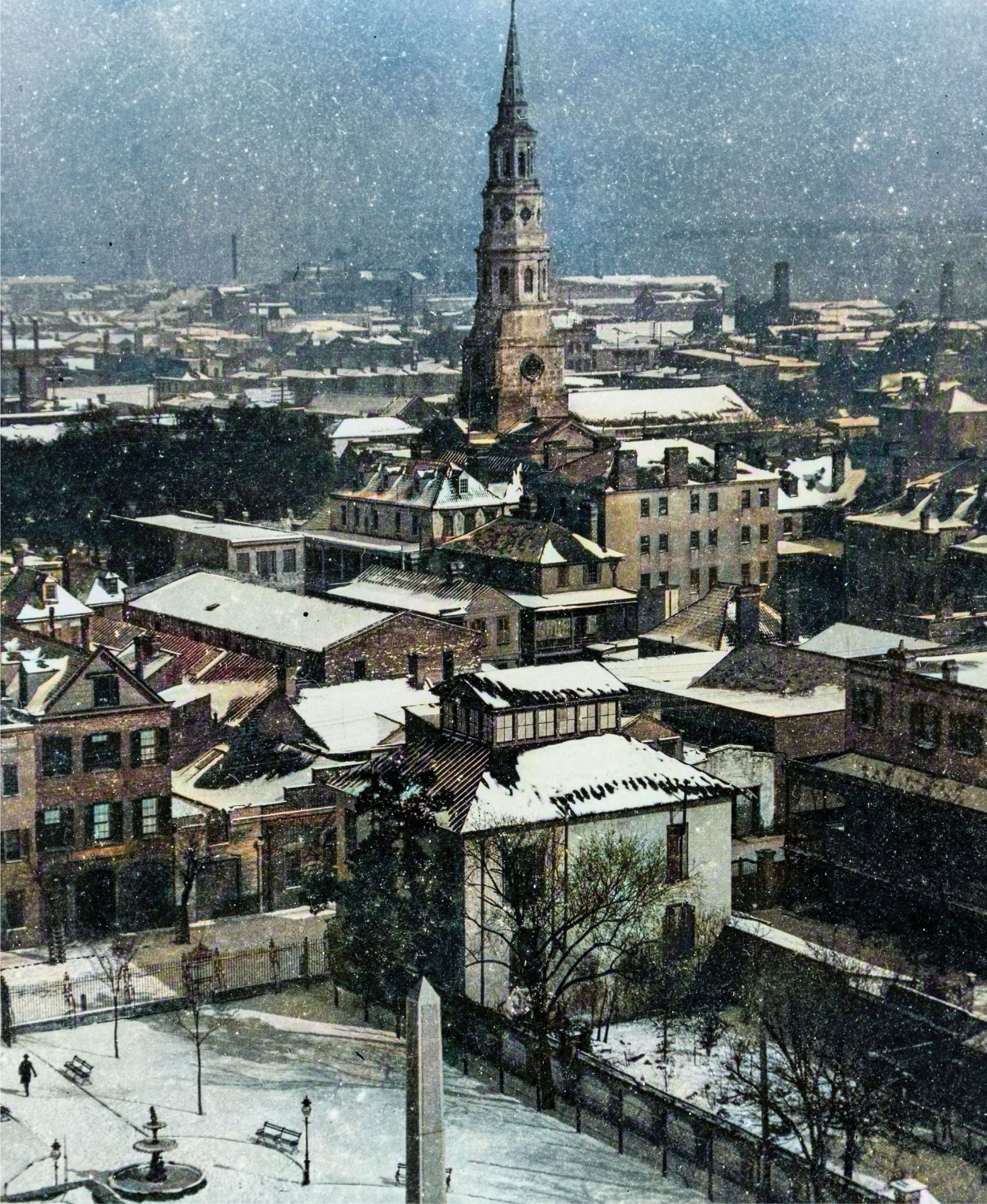 Snowy Rooftops of Charleston, 1899, by Robert Achurch (1866-1943) Climbing high above the city, Achurch focused his camera on the parallel line between the Washington Light Infantry monument and St. Philip’s Church.