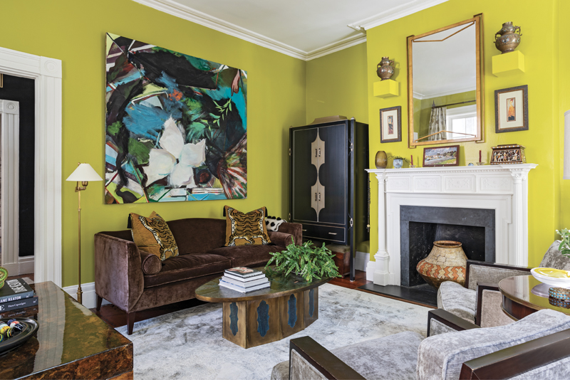 WORLDLY TREASURES: In the drawing room, velvet and metallic touches infuse the space with glamour, and contemporary art mingles seamlessly with finds from around the world, including a handmade jug from Peru, an ornamental box from Egypt, and a 1950s coffee table. Above the Baker sofa hangs a large-scale abstract by Jeannie Weissglass. “She’s from Brooklyn, but, of course, being a Southerner I see a magnolia in there,” says Michael.