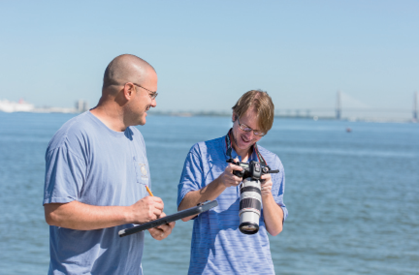 Eric Zolman and Todd Speakman (with camera) work to photo-ID and monitor our dolphin population.