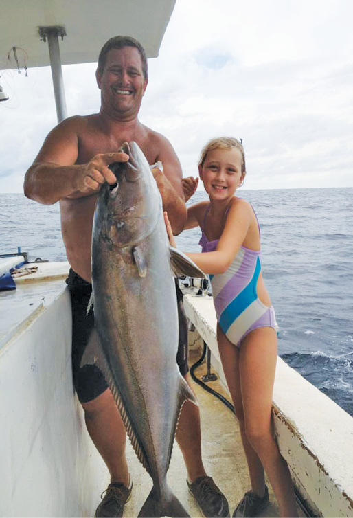 The fishing tradition continues with Mark’s eldest son, Andrew (not pictured), who has joined the business, and the Marhefkas’ younger children—Rebecca, with an amberjack in 2013...