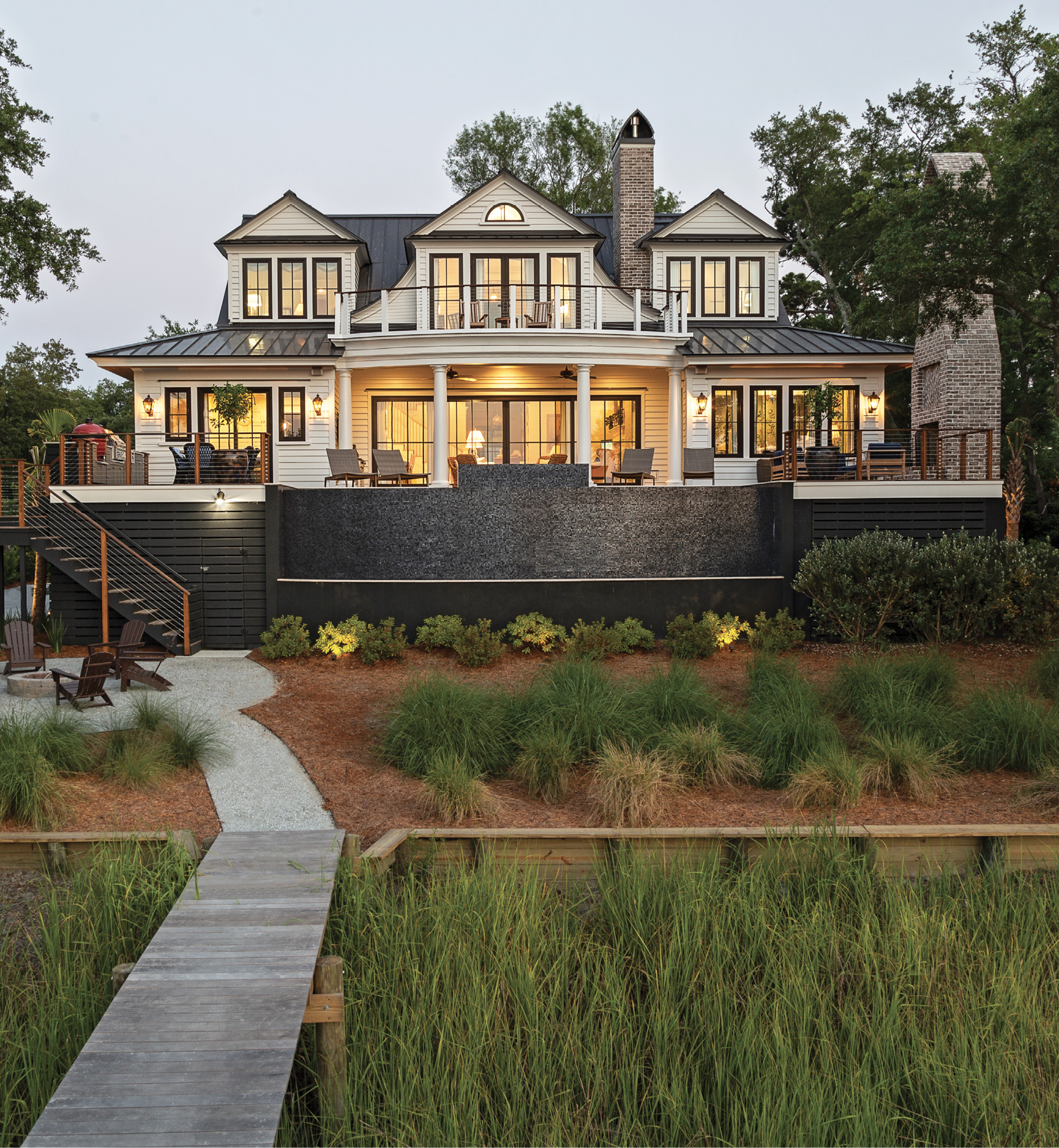 WHAT DREAMS ARE MADE OF: Martha Nagle-Halvorson wanted to build her dream home as a replica of the classic Lowcountry houses she grew up surrounded by during her childhood. “I didn’t want anything over-the-top or too big,” she says. The result is a beautiful, 3,400-square-foot home that perfectly marries traditional architecture with modern outdoor living, while taking in quite possibly the best views in all of Charleston.