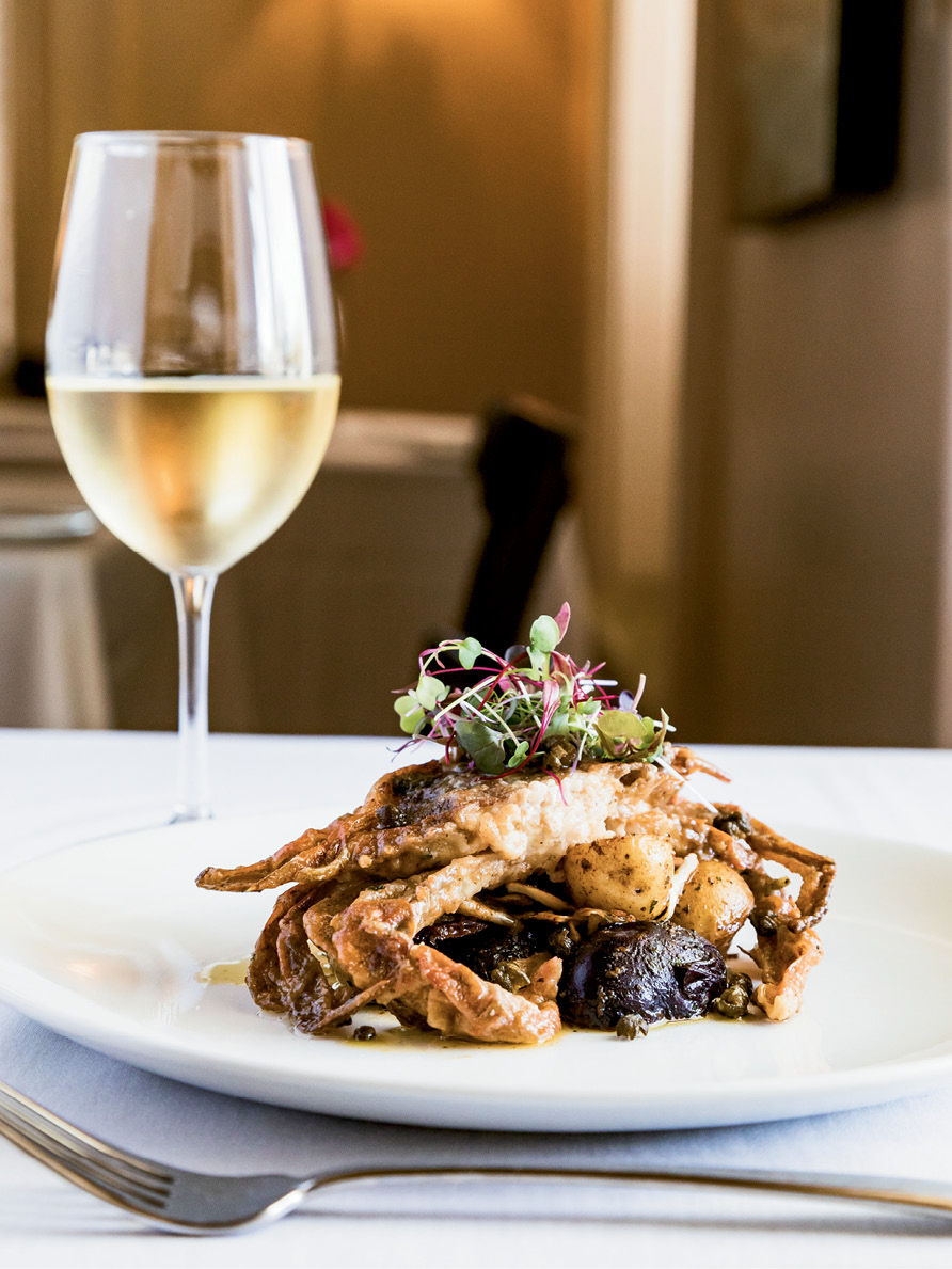 Sauteed soft-shell crab with lemon caper sauce at the Anchorage 1770’s Ribaut Social Club