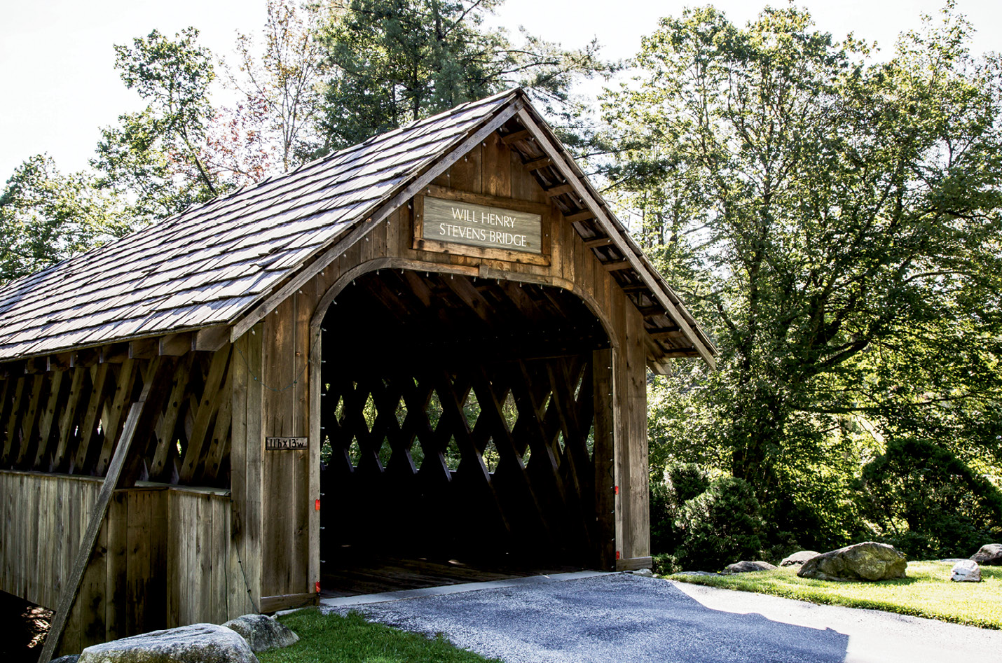 The covered bridge entrance to The Bascom arts center is a reclaimed wooden structure named for artist Will Henry Stevens.