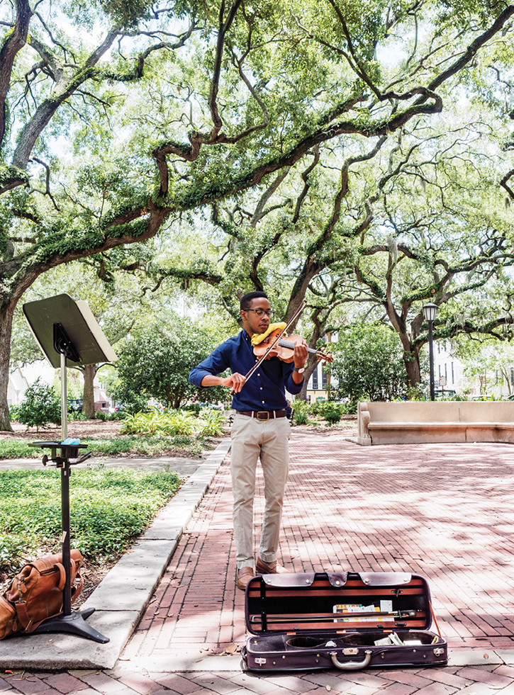 Violinist Michael Houston of Beaufort says he prefers playing in Savannah squares because “people are more relaxed” and listen awhile.