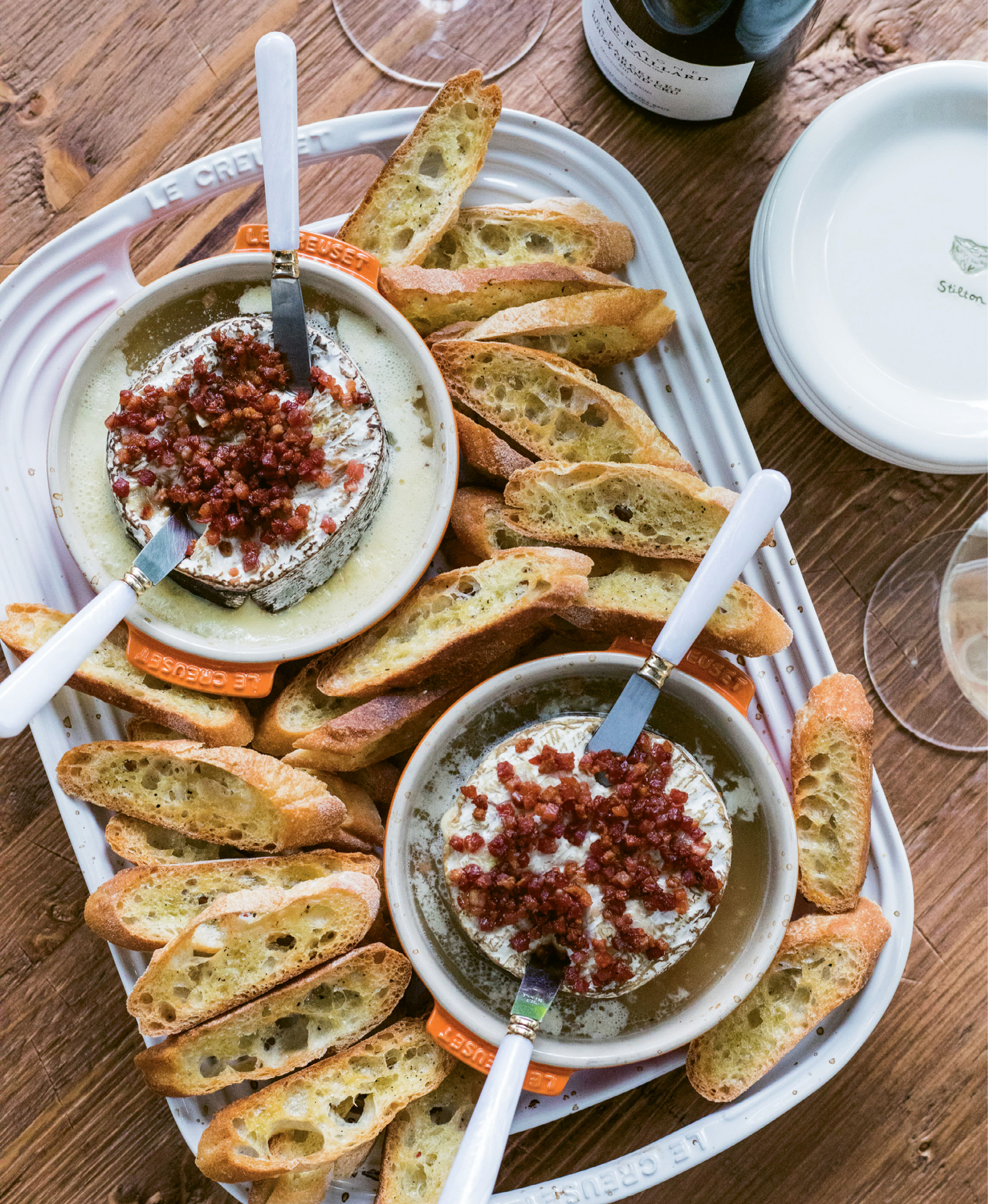 Cheese, Please - Luscious Rush Creek Reserve gets baked with garlic, sautéed pancetta, and a splash of Champagne for an irresistible appetizer served with toasted baguettes.
