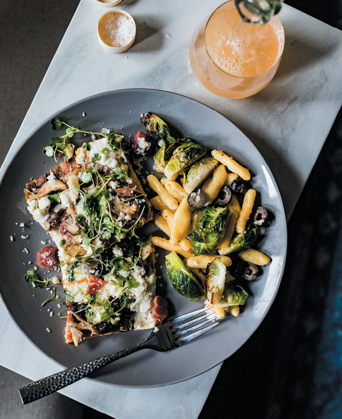 Whole wheat pizza and pasta salad are lightened up with seasonal toppings, while a fizzy rosé cocktail rounds out the meal.