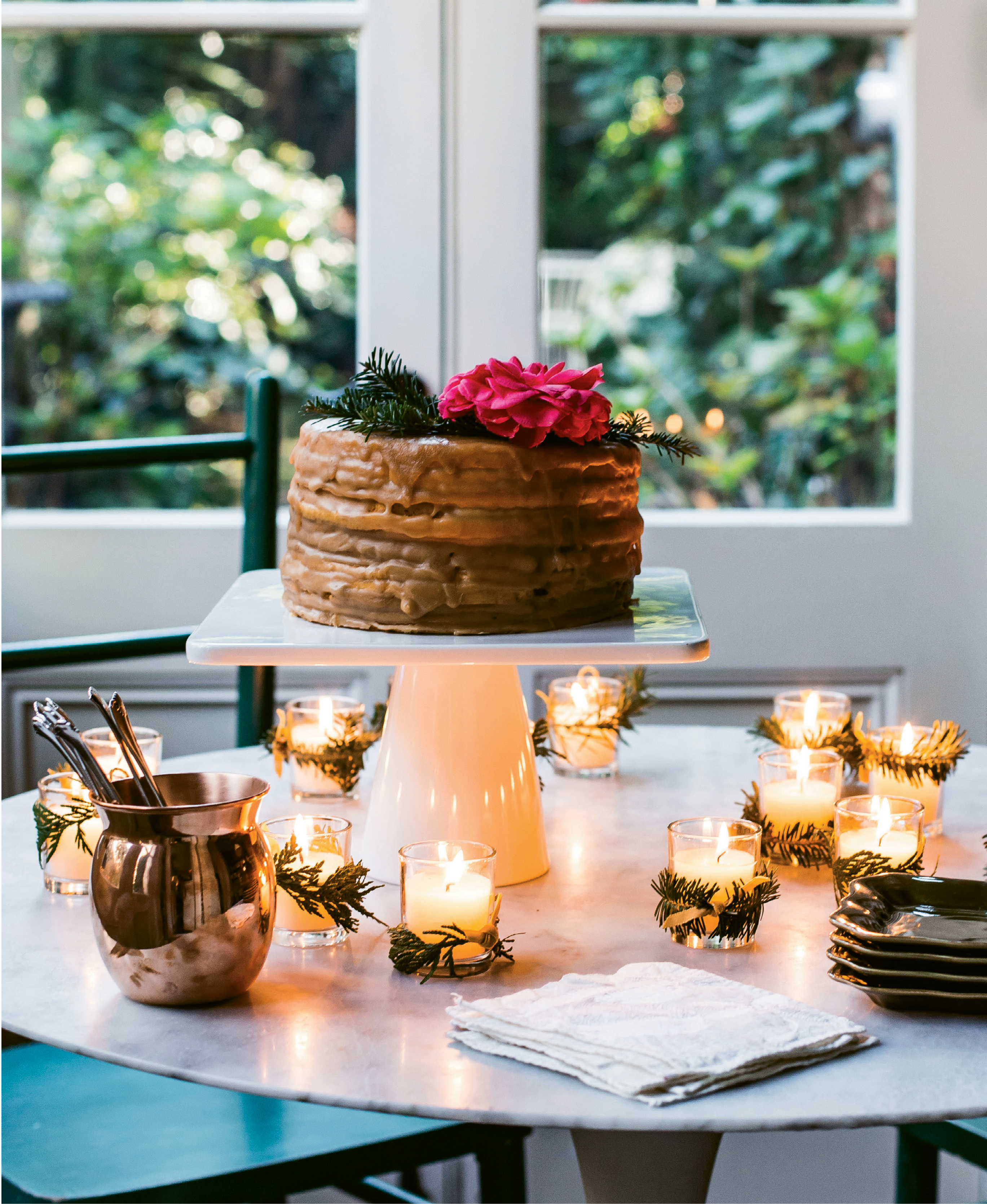 ATTENTION TO DETAIL: The right serving pieces make desserts as much a feast for the eyes as they are otherwise. Here, a home-style caramel cake from Halls Chophouse is elevated when showcased on a tall cake stand
