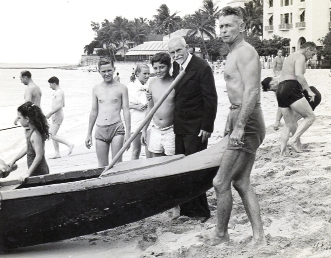 NATIVE TALENT Charleston’s own Alexander Hume Ford (pictured here in a suit at Waikiki’s Outrigger Canoe Club, which he founded in 1908) saved the sport of surfing from oblivion.