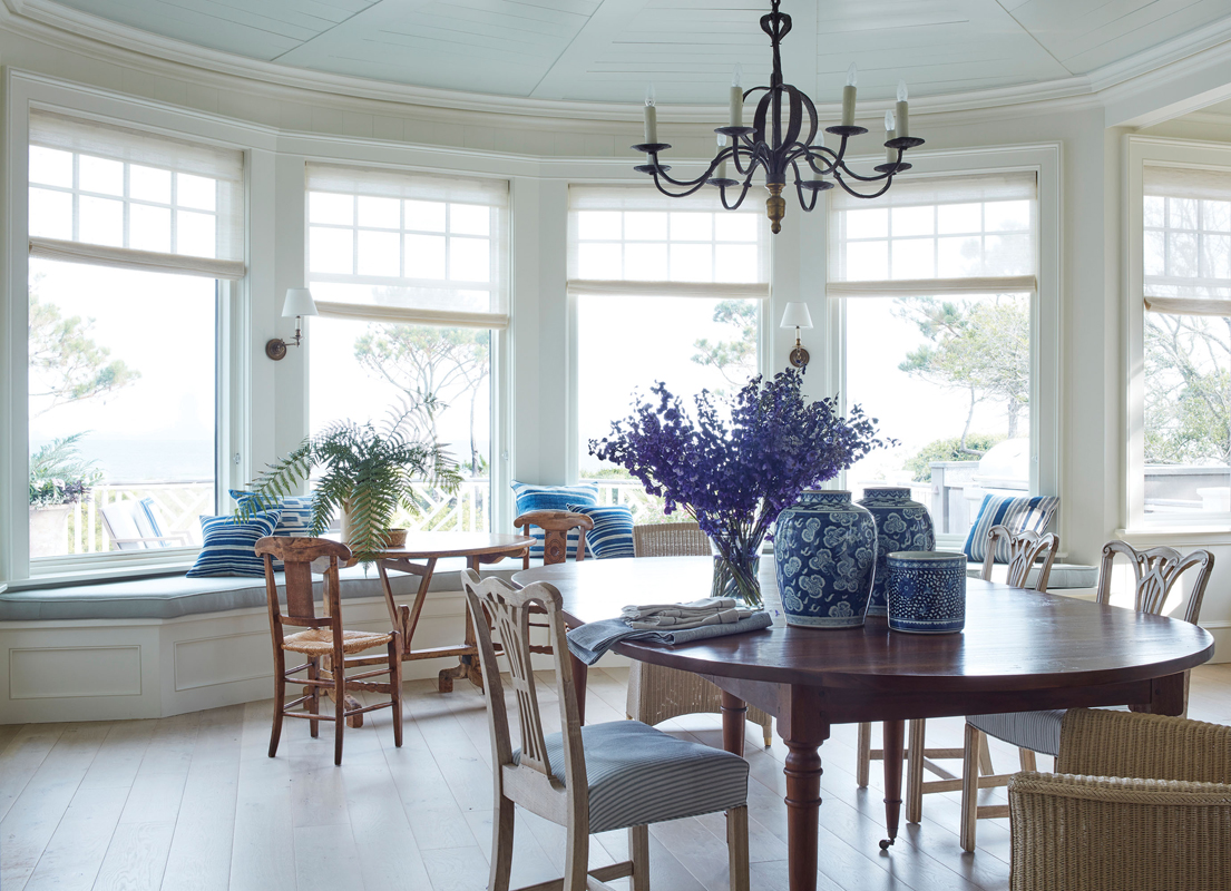 Eating In: A casual dining room with an antique table and chairs by Garden Variety Design occupies the same space as the kitchen, lending itself to elegant suppers in a relaxed atmosphere.