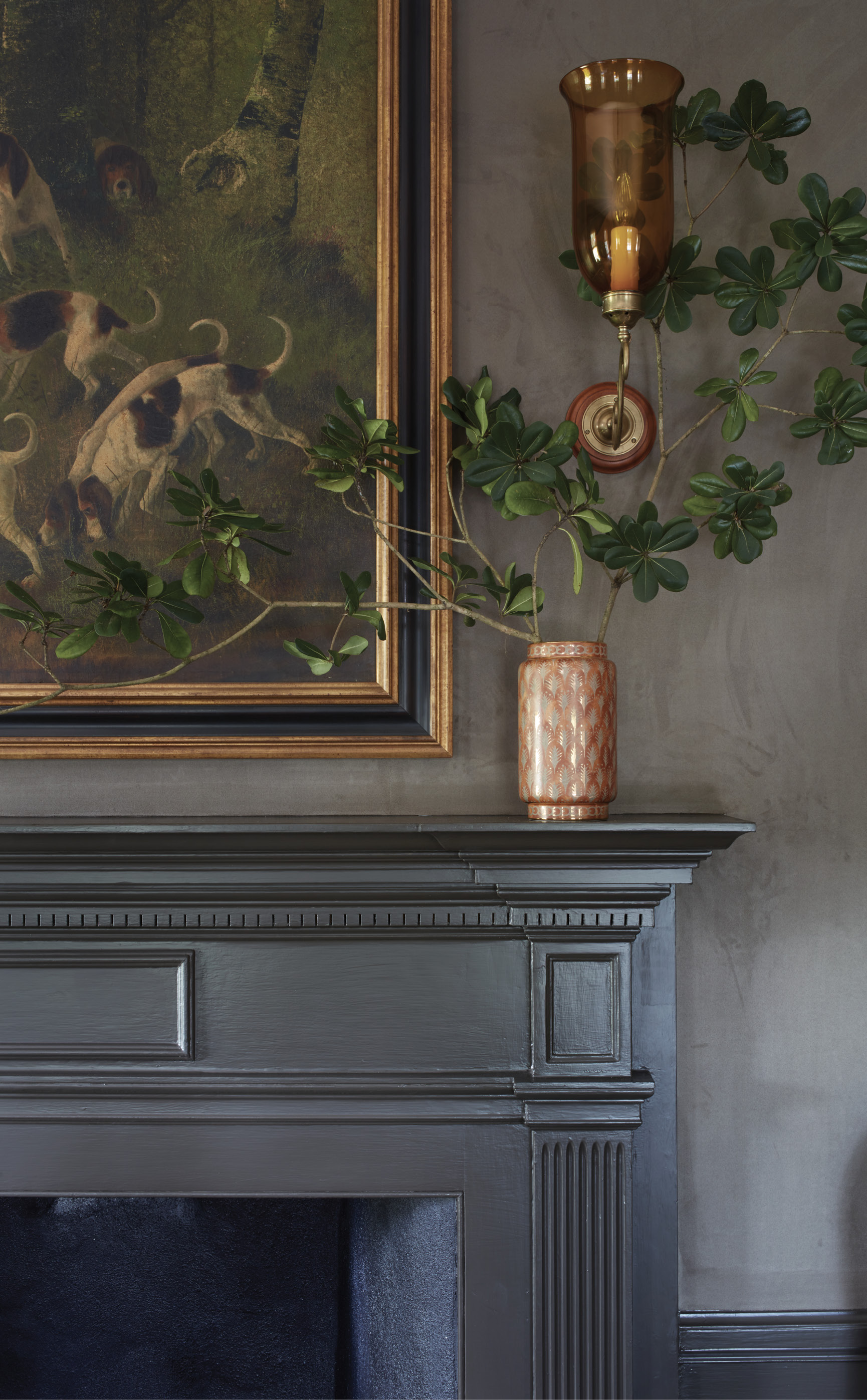 The homeowner’s personal art collection celebrating sporting dogs adorns the walls and takes pride of place above the mantel.