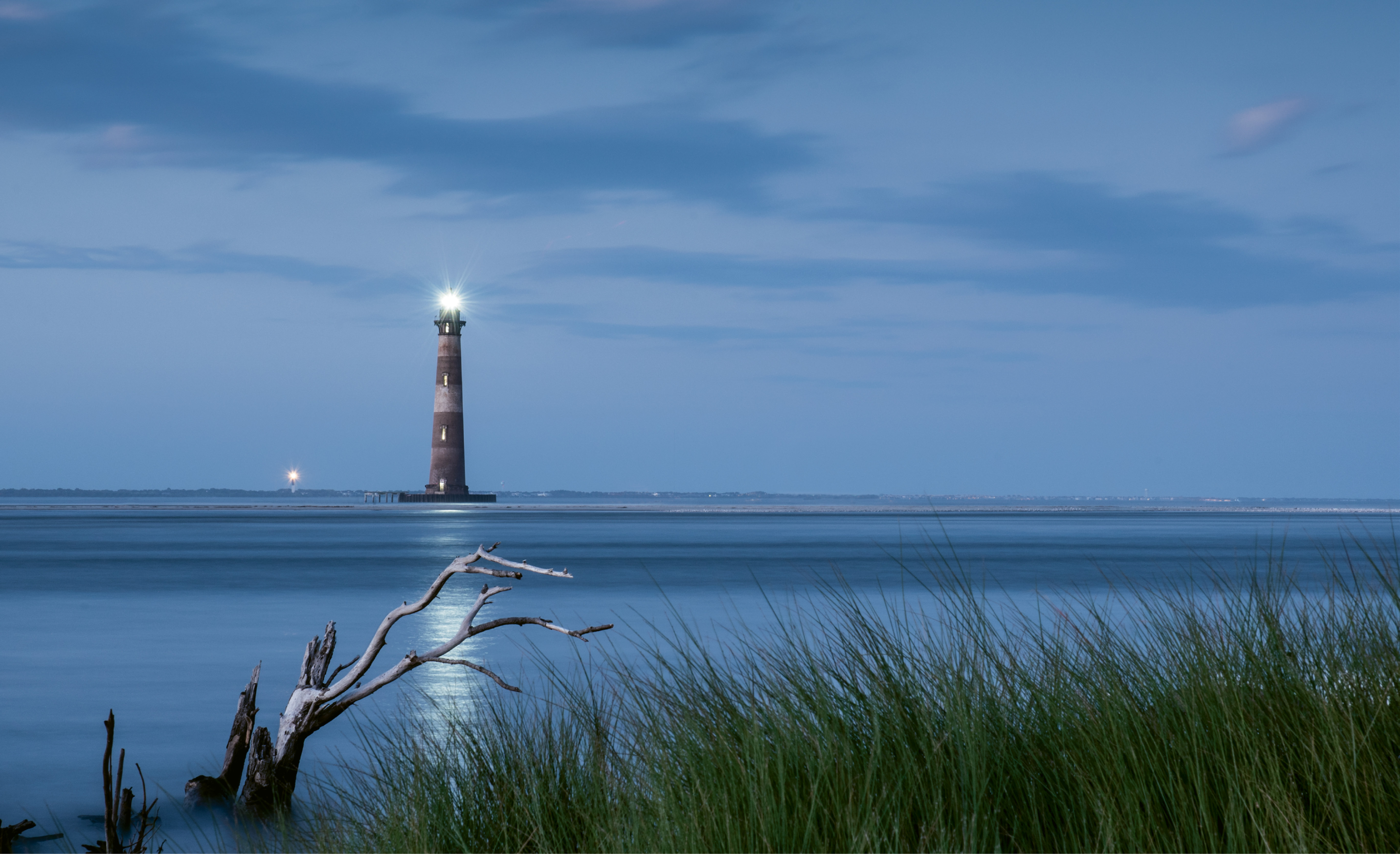 Two Lights Burning by Charles Hooker  {Professional category} - The re-illumination of the Morris Island Lighthouse on October 1, 2016
