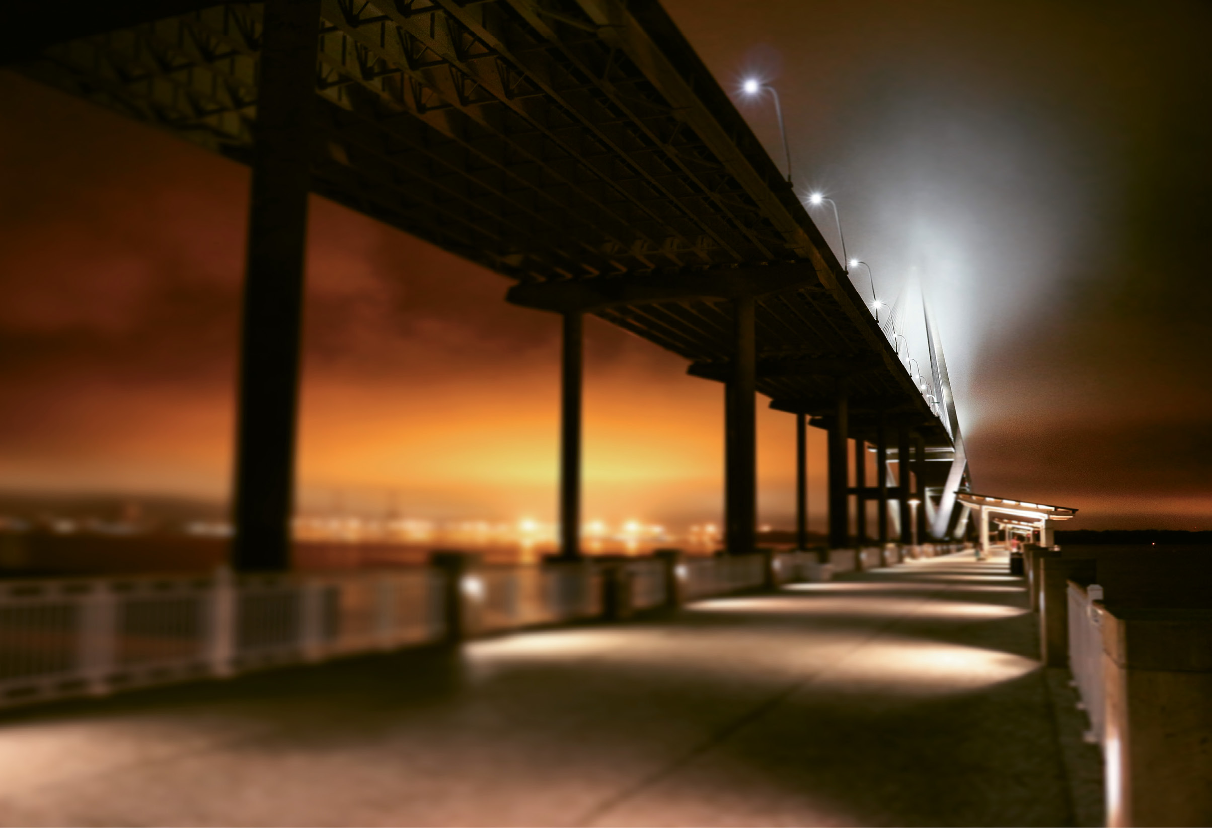 A Walk Under the Bridge by Samuel Hunter  {Amateur category} - The orange glow of light pollution as seen from Mount Pleasant’s Memorial Waterfront Park