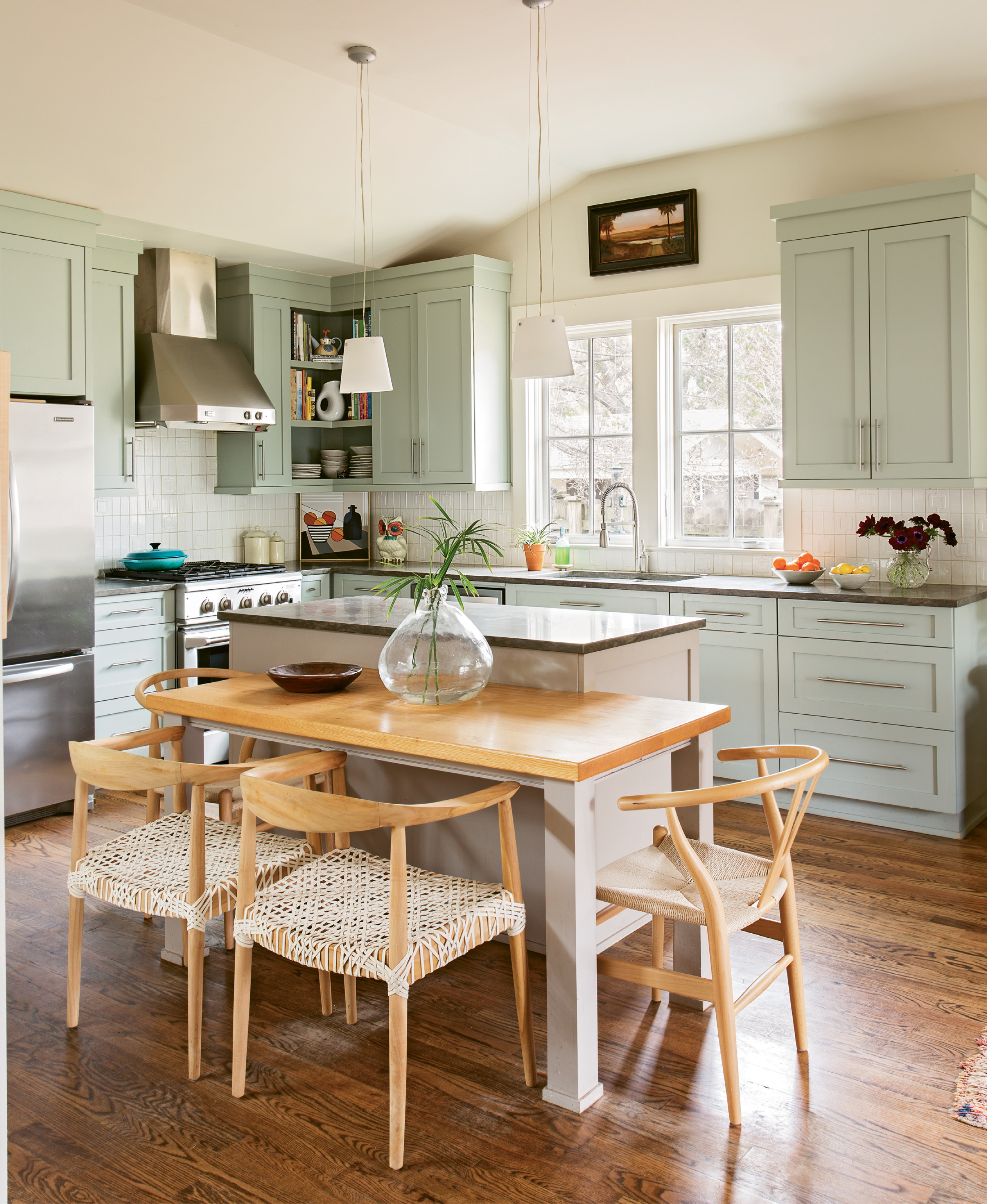 Clean Eating: In the kitchen, area carpenter Robert Buxton built the custom asymmetrical table, which adds a contemporary design element as well as an informal space for the family to gather for meals.