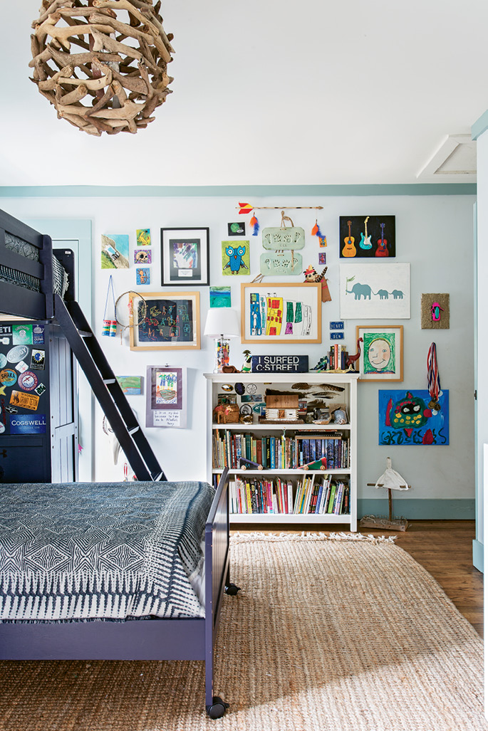 Ben and Henry’s room features a gallery wall with the boys’ own artwork, as well as handicrafts they created at Huck Finn School in Mount Pleasant.