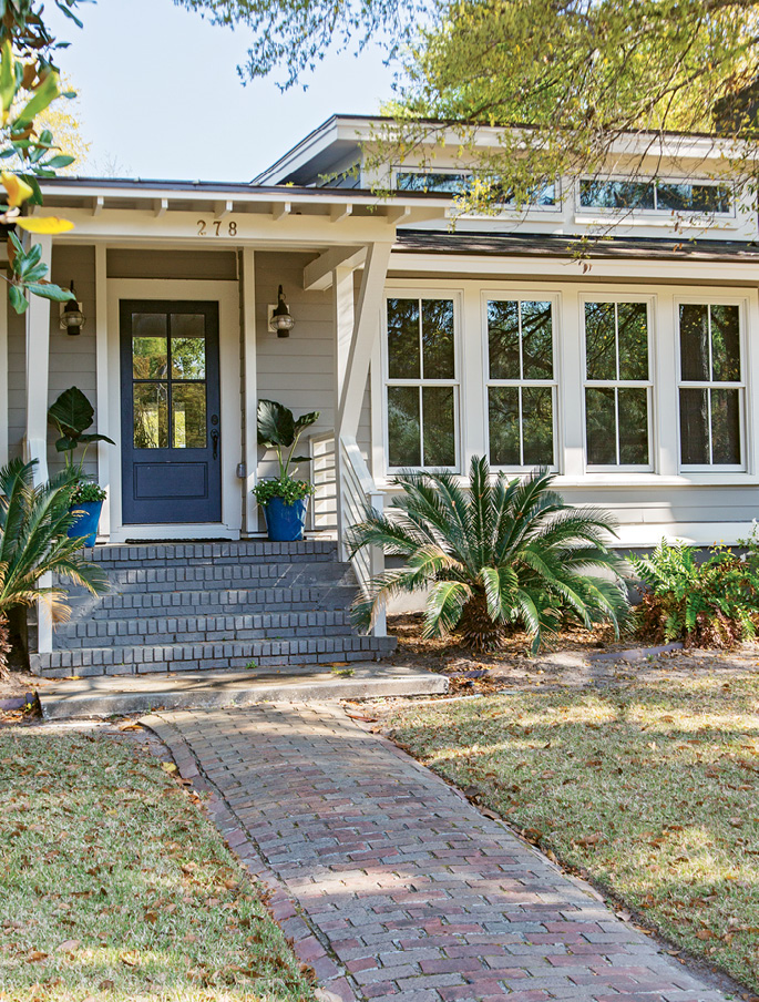 Raise the Roof: The couple renovated the home in 2008 with help from architectural designer Hunter Kennedy, who raised the roof line via a shed dormer with clerestory windows and swapped out the brick façade for sleeker-looking slate-grey siding.