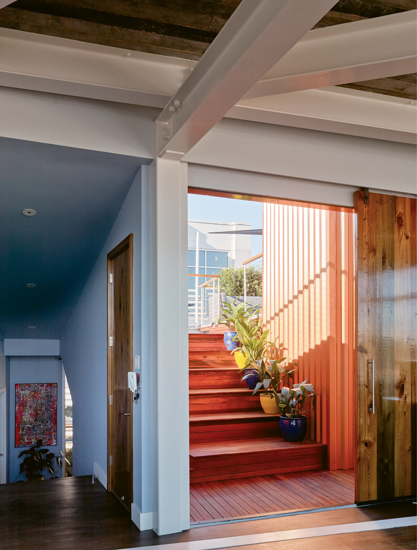 A ramp leads to a green roof offering 360-degree views of the city and beyond.