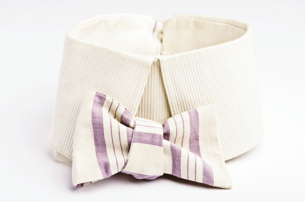 HIGH COTTONThese early 20th-century cotton ties came with collars. The purple one bears the stamp: “The Corsair. / Patent Feb. 18, 1900” and has a buttonhole for attaching to the shirt. A slit on one side allows the tie to wrap around the neck, making it adjustable.
