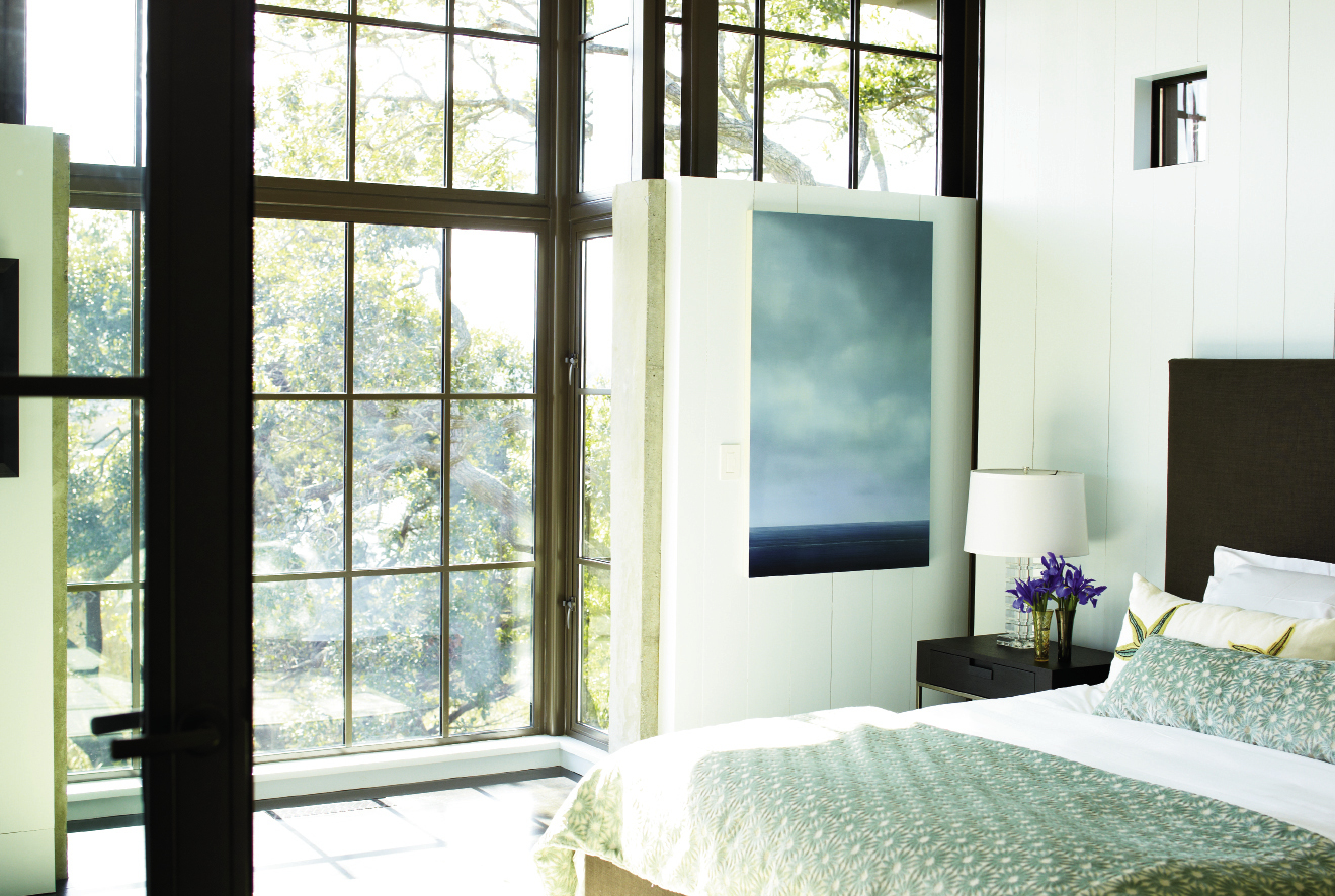 Dream State: Light from the marsh streams into the master bedroom, outfitted with a B&amp;B Italia/Maxalto bed,  bedding from GDC, and a painting by Vermont artist Peter Brooke.