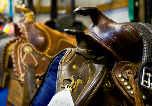 Rooms are piled high with country-Western wear as well as saddles, tack, and rodeo equipment.
