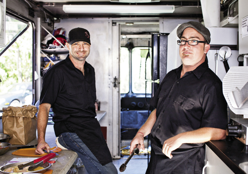 Jonathan Colarusso (left) and brother Brian work inside the Strada Cucina truck