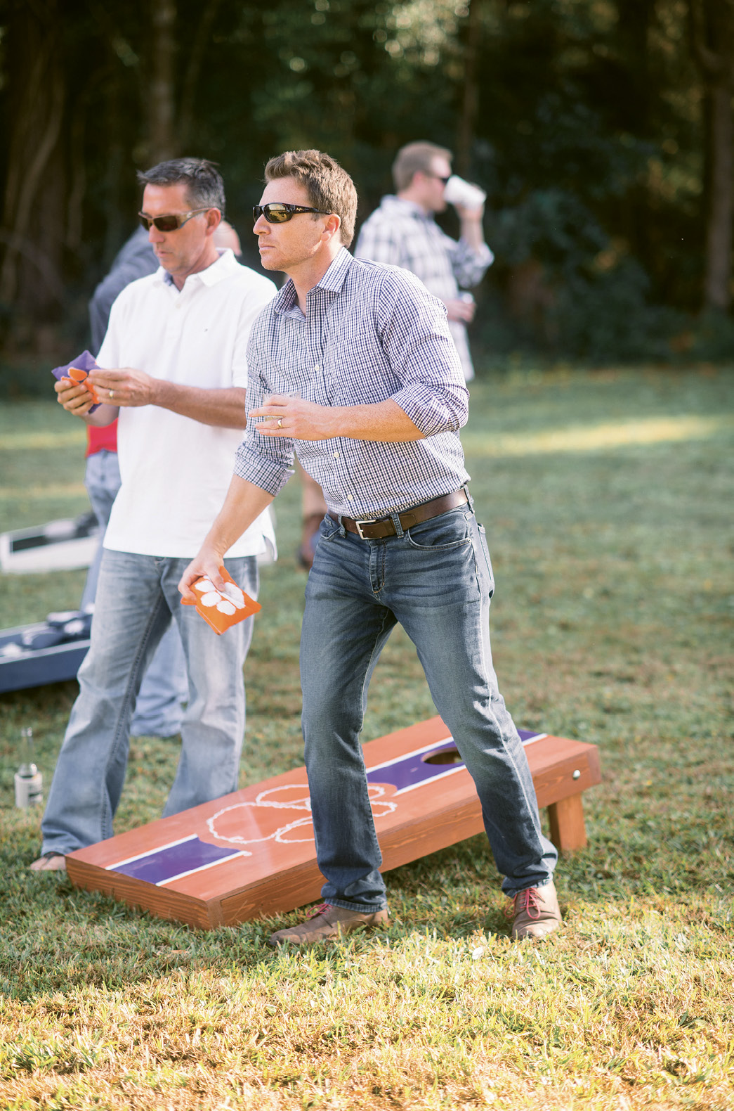 Game On: Partygoers played corn hole on the couple’s personal (and school-spirited) boards.