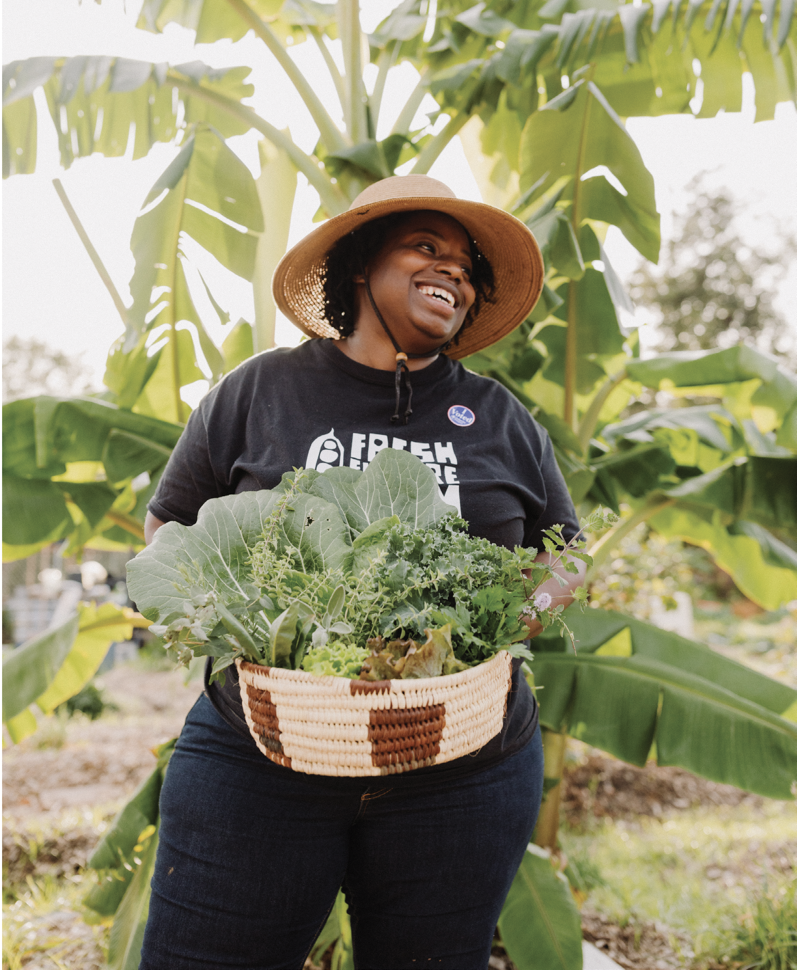 Farmer and community visionary Germaine Jenkins revels in a harvest of healthy greens from her North Charleston nonprofit, Fresh Future Farm.