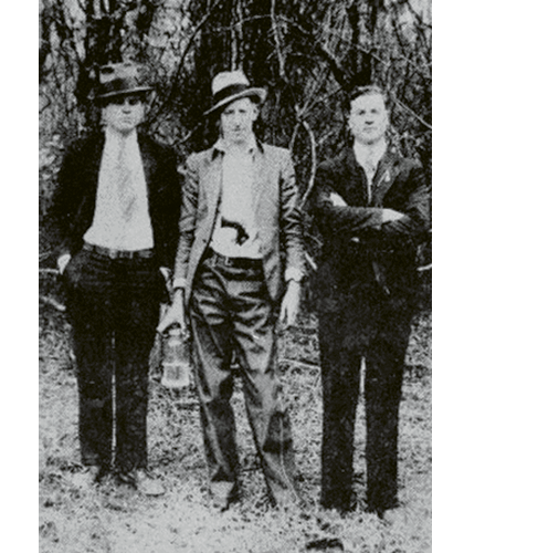 (Left to right)  Al Capone, David Shuler, and an unknown man in Hell Hole Swamp; “Mr. Shuler ran a mercantile store in Jamestown. This photo hung in his store until it closed,” says Jamestown resident Douglas Guerry.