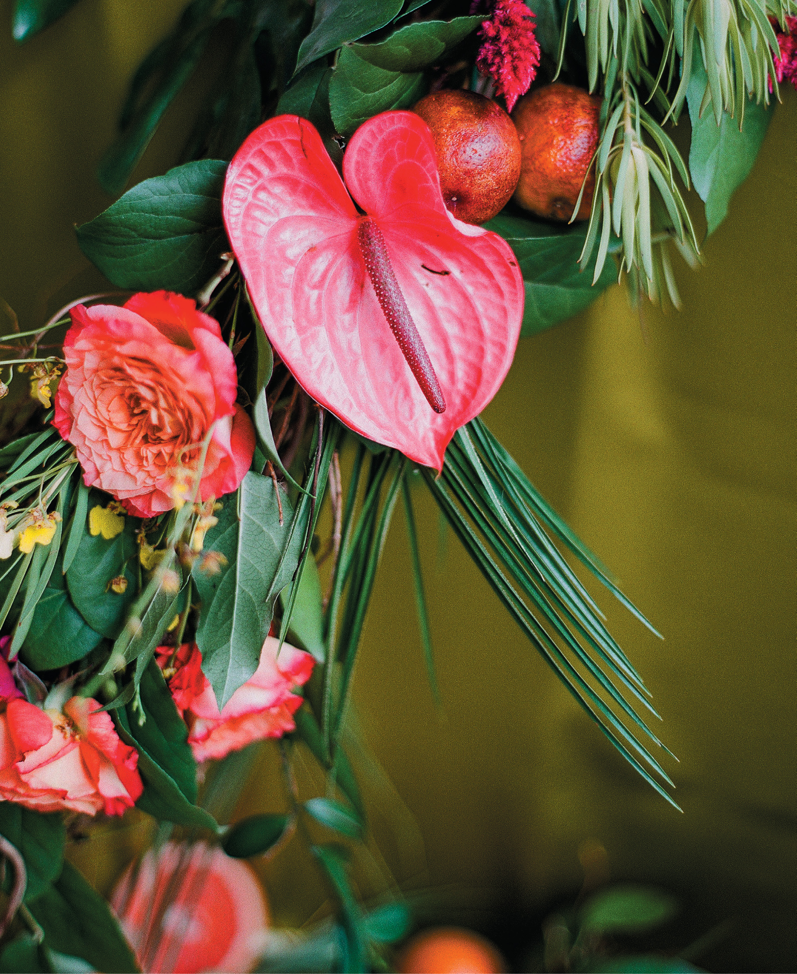 The Vault hostesses Julie Livingston and Reagan Barnes collaborated with floral designer Wimberly Fair on the party’s lush, exotic flora, including anthurium, garden roses, pincushion protea, and orchids amidst Leucadendron, monstera, and palm greenery.
