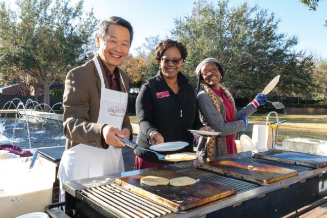 Hsu mans a griddle during the December 2019 Pancakes with the President event held during final exams.