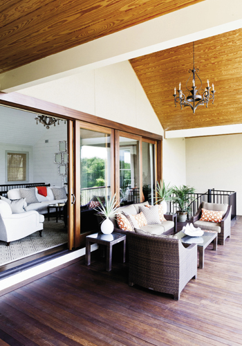 Lofty Ideas: The wide-open great room gives way to a cozy porch with vaulted ceilings.