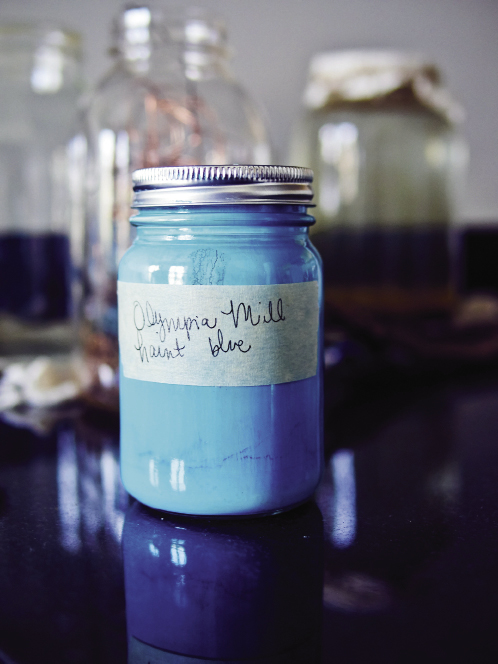 Blue is a favorite color of Magar’s, so she recently learned the South Carolina-born indigo-dyeing process and put it to use in the collection. As a nod to the friendly spirits she’s sensed in the historic building, she mixed a custom paint color she calls “Olympia Mill Haint Blue.”
