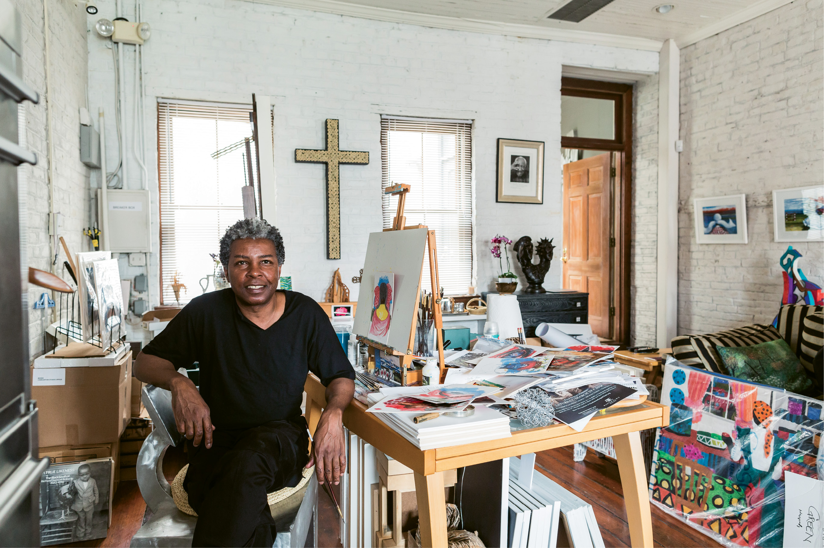 Green, at work in his downtown studio, is dressed in what he calls his “uniform” (always a black T-shirt and pants).