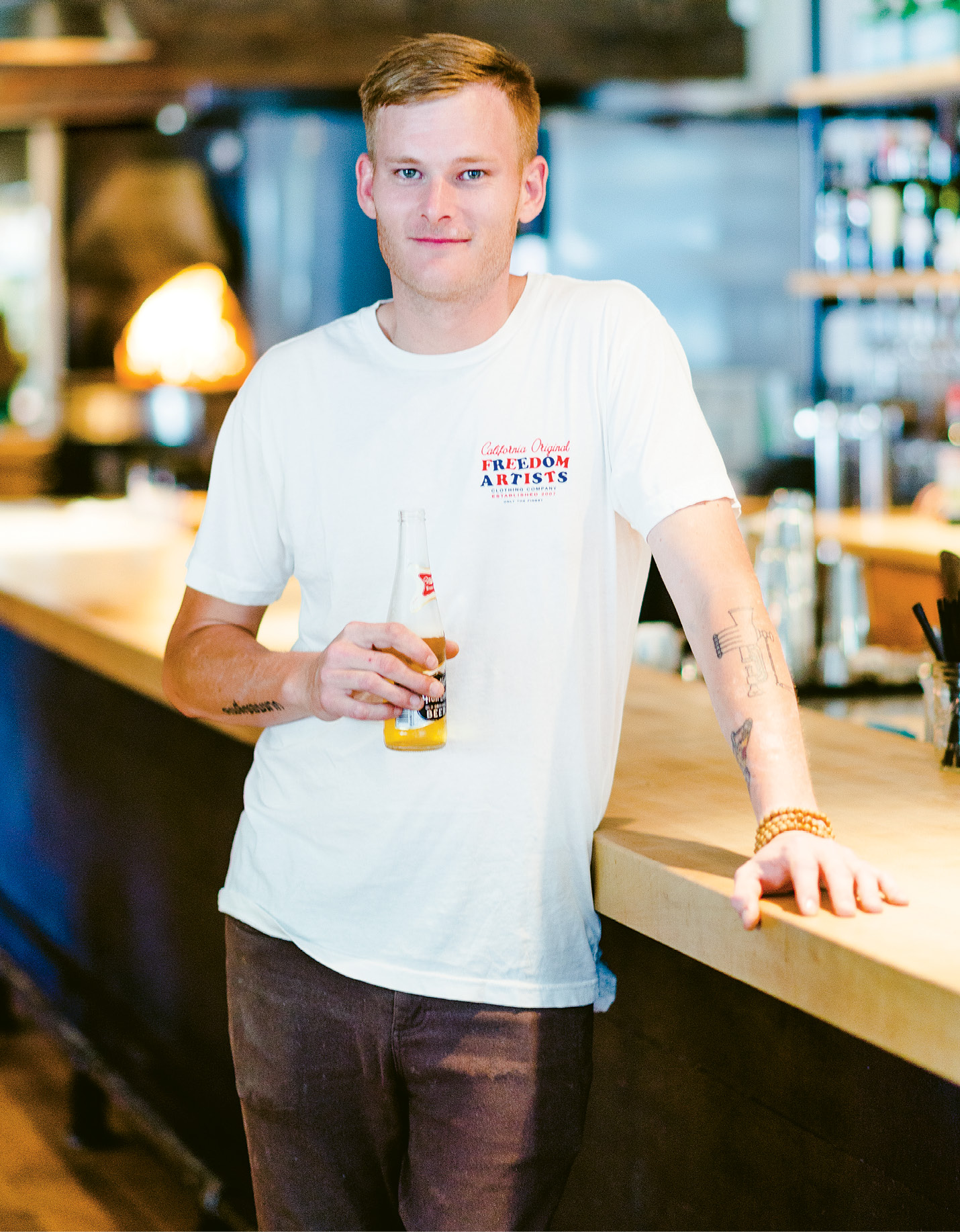 Getzewich by the bar at Indaco with his favorite beer; “I’ll make you spaghetti and meatballs—it’s not my job to say ‘no.’ But I like guiding diners to trying something they’ve never had.”