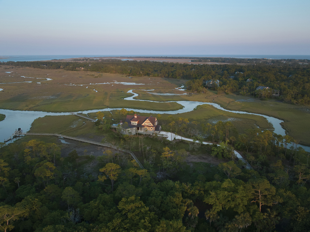 The Kiawah River wraps around the house, which boasts views of the island all the way down to Folly Beach. “The shape and the setbacks of the property determined what form the house would take,” says architect Marc Camens. “But while these constraints represented a challenge, they are also the home’s biggest asset.”