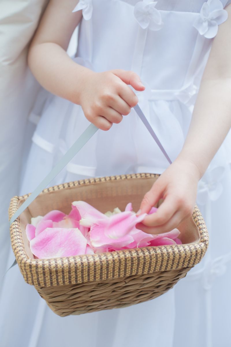 SPECIAL SPRINKLES: The flower girl paved the way for the bride using pink rose petals.