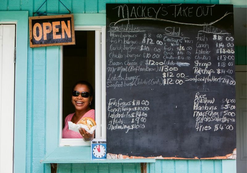 Friendly window service at Mackey’s Takeout, a favorite lunch stop for fresh seafood.