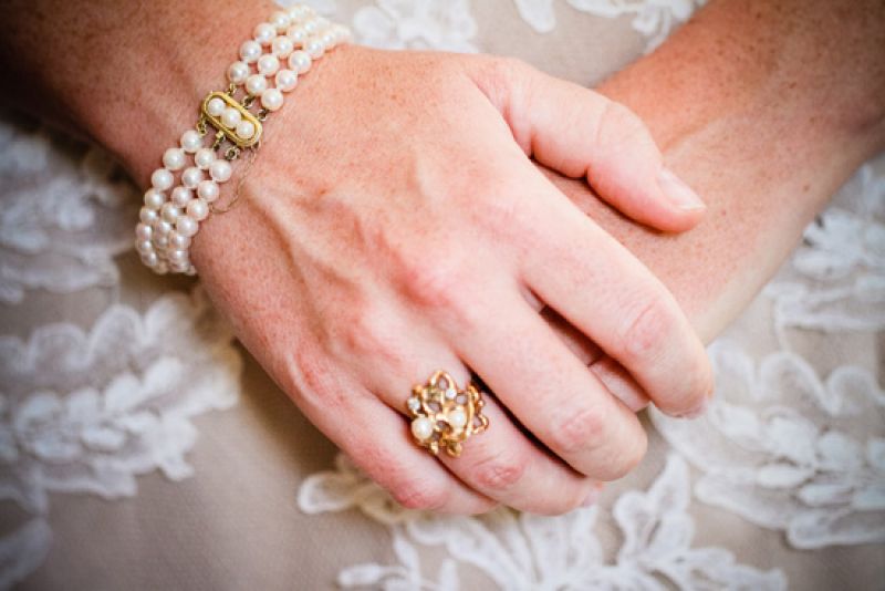 THE PERFECT TOUCH: Jewelry from her stepmother’s side of the family fit the bill for the bride’s “something borrowed.” Carrie says she loved how the pieces fit in with the evening’s vintage vibe.