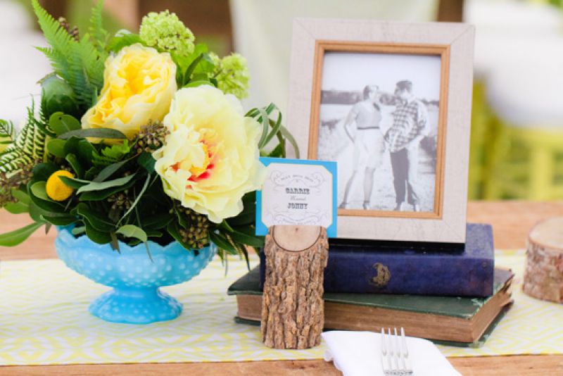 RUSTIC CHIC: Wooden accents and antique books gave the tables a vintage vibe. “We’re fans of eclectic, vintage, one-of-a-kind finds,” says Carrie.