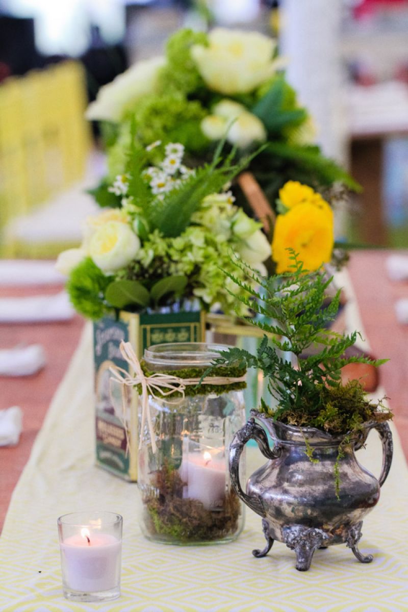 INDOOR-OUTDOOR: Out of Hand married natural touches like moss and straw met with tarnished silver and Mason jar vessels.