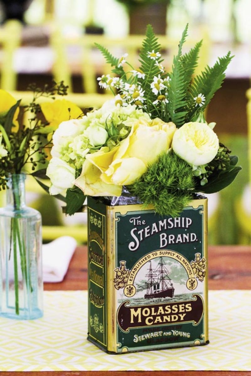 JUMP BACK: Ooh! Events filled vintage vessels with chamomile, dill, fern fronds, green hydrangea, and yellow roses.