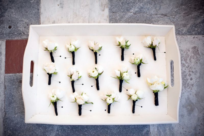 SUIT UP: Brian and his groomsmen wore classic boutonnieres of white spray roses.
