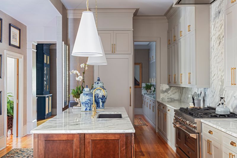 The couple chose Sumatra white quartzite from AGM Imports for the kitchen counters, island, and backsplash—all fabricated by Martol Marble &amp; Granite.