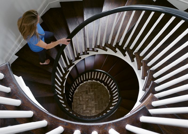 In the main residence, a circular staircase rises three stories to the family’s private quarters.
