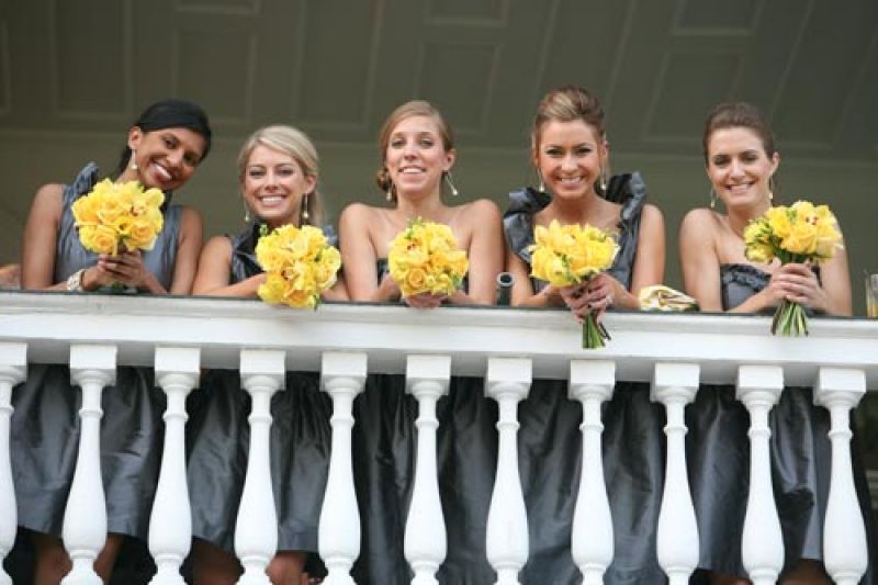GOLDEN GIRLS: Yellow bouquets popped against the bridesmaids’ gray frocks from LulaKate.