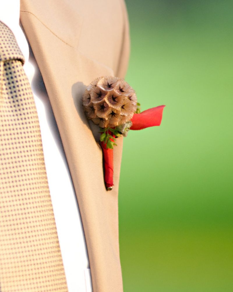 POWER OF A LITTLE FLOWER: An eye-catching boutonniere complemented Moyer’s poplin suit from Joseph A. Banks.