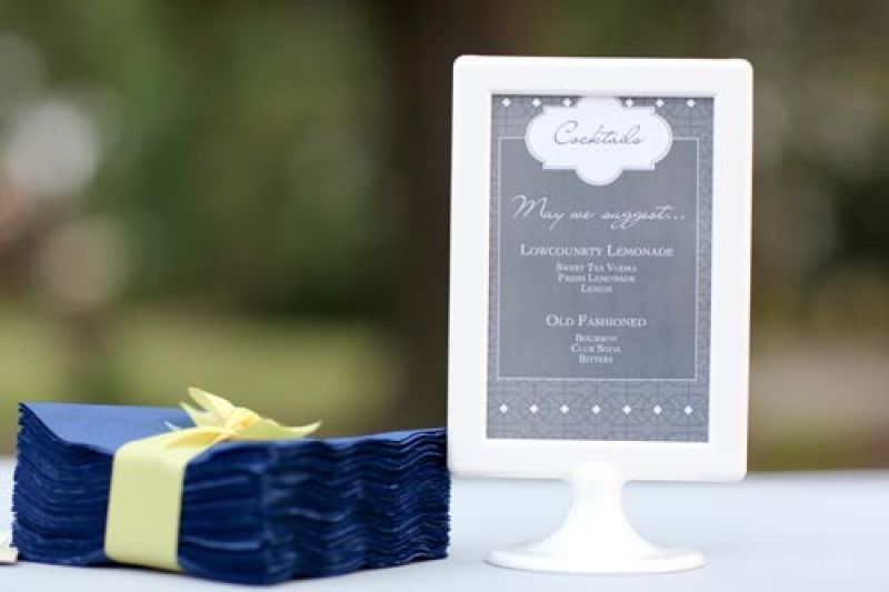 HAPPY HOUR: Though shades of yellow and gray dominated the color palette, hints of blue were splashed throughout the reception décor and stationery suite.