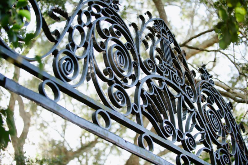 A SENSE OF PLACE: Lowndes Grove’s wrought iron gate—a common sight throughout the Holy City—added to the “quintessentially Charleston” look Chloe wanted.