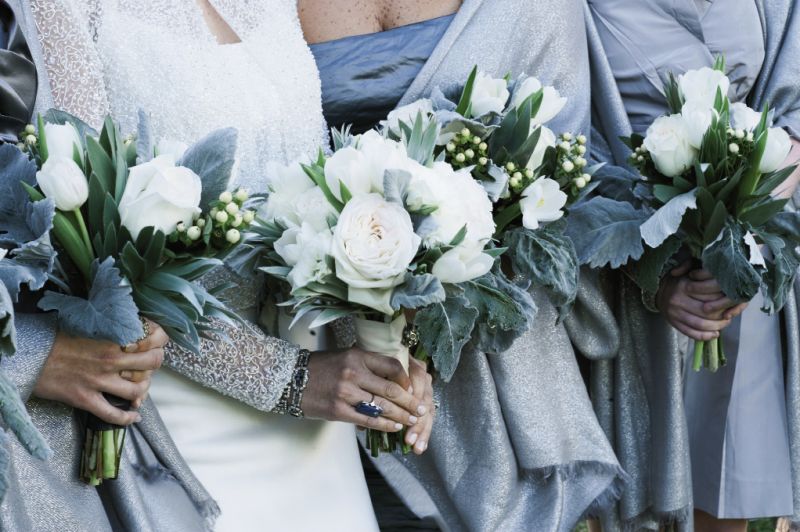 SILVER BELLES: Chloe asked bridesmaids to wear a silver or gray dress of their choosing and gifted each of them a silver wrap to keep warm and to tie their varied looks together.