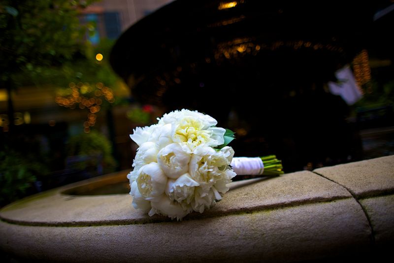 FRAGRANT BUNCH: The bride carried a lush bouquet of white peonies.
