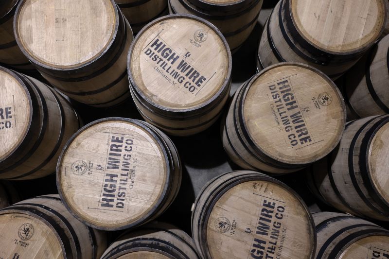 Well-Stocked: Whiskey barrels at High Wire Distilling Co. on Huger Street.